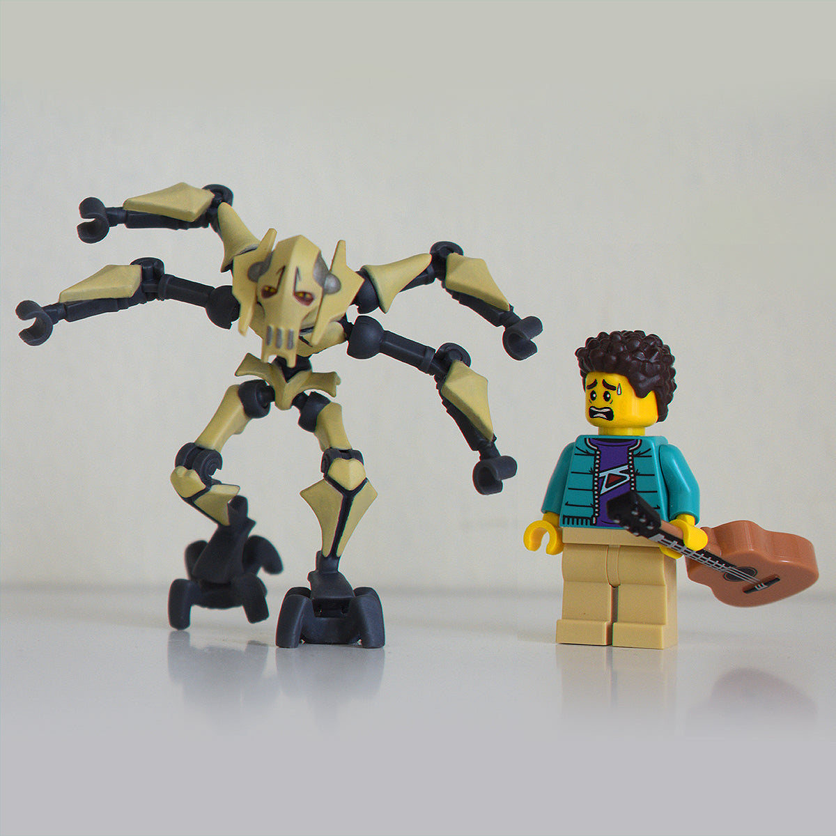 general grievous custom lego figure standing next to a lego minifigure